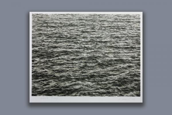 A black-and-white lithograph of rippling ocean waves, meticulously drawn by Vija Celmins so as to appear like a black-and-white photo.